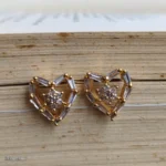 Open Heart Crystal Earrings with Clear Baguette Stones and Gold-Tone Details - Image 2