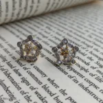 Geometric Pentagon Crystal Earrings with Silver-Tone Stones and Gold Details