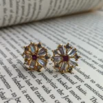 Ruby Stone in Center Baguette Crystal Starburst Earrings with Gold-Tone Prong Settings