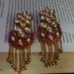 Nature inspired Kundan Earrings with long chain in Red Color